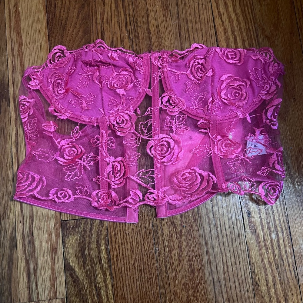 Pink sheer tube top with roses.